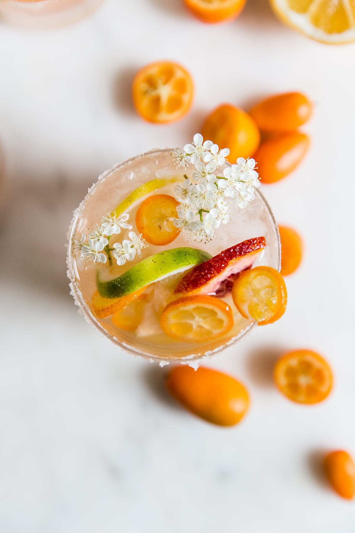 Rosé wine sangria in a glass with citrus fruit