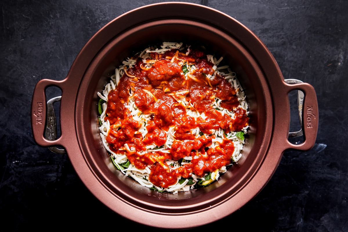 tomato sauce and cheese layered into a crockpot